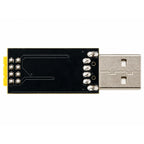 ESP-01 USB adapter showing the rear of its black PCB, solder connections and USB-A plug.