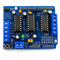 L293D Motor Driver Shield for Arduino Uno front view showing the shield layout, L293D motor driver ICs, connectors, and Arduino headers.